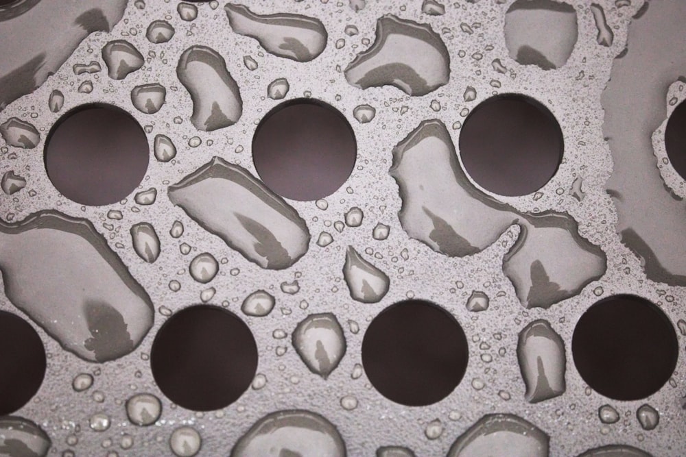 a close up of water droplets on a surface