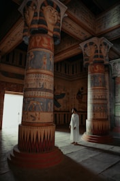 a person standing in a room with columns