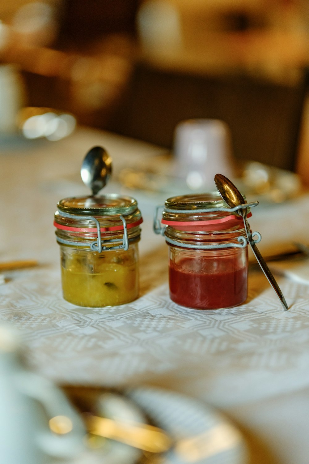 two jars of food sitting on top of a table
