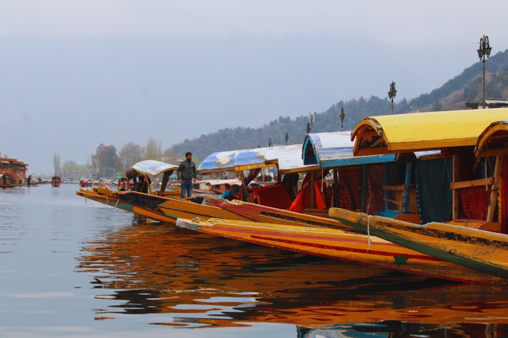 a group of boats floating on top of a lake