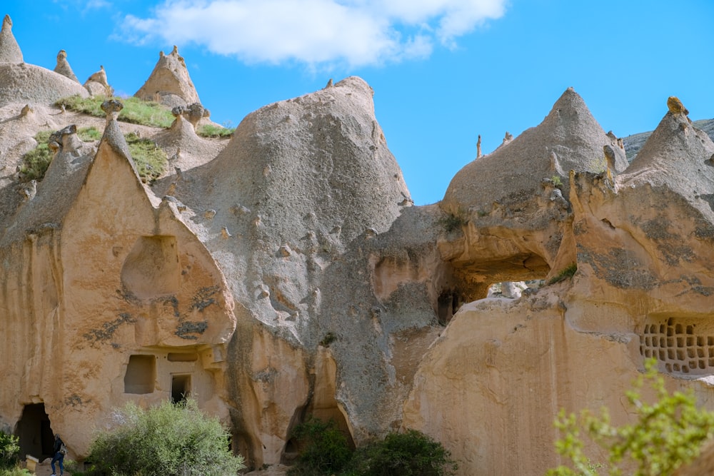 a group of rock formations with holes in them