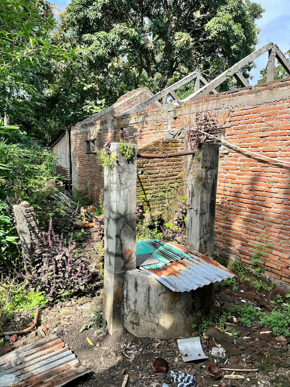 an old brick building with a rusty roof