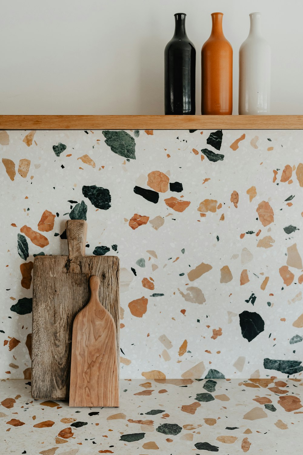 a wooden cutting board sitting on top of a counter