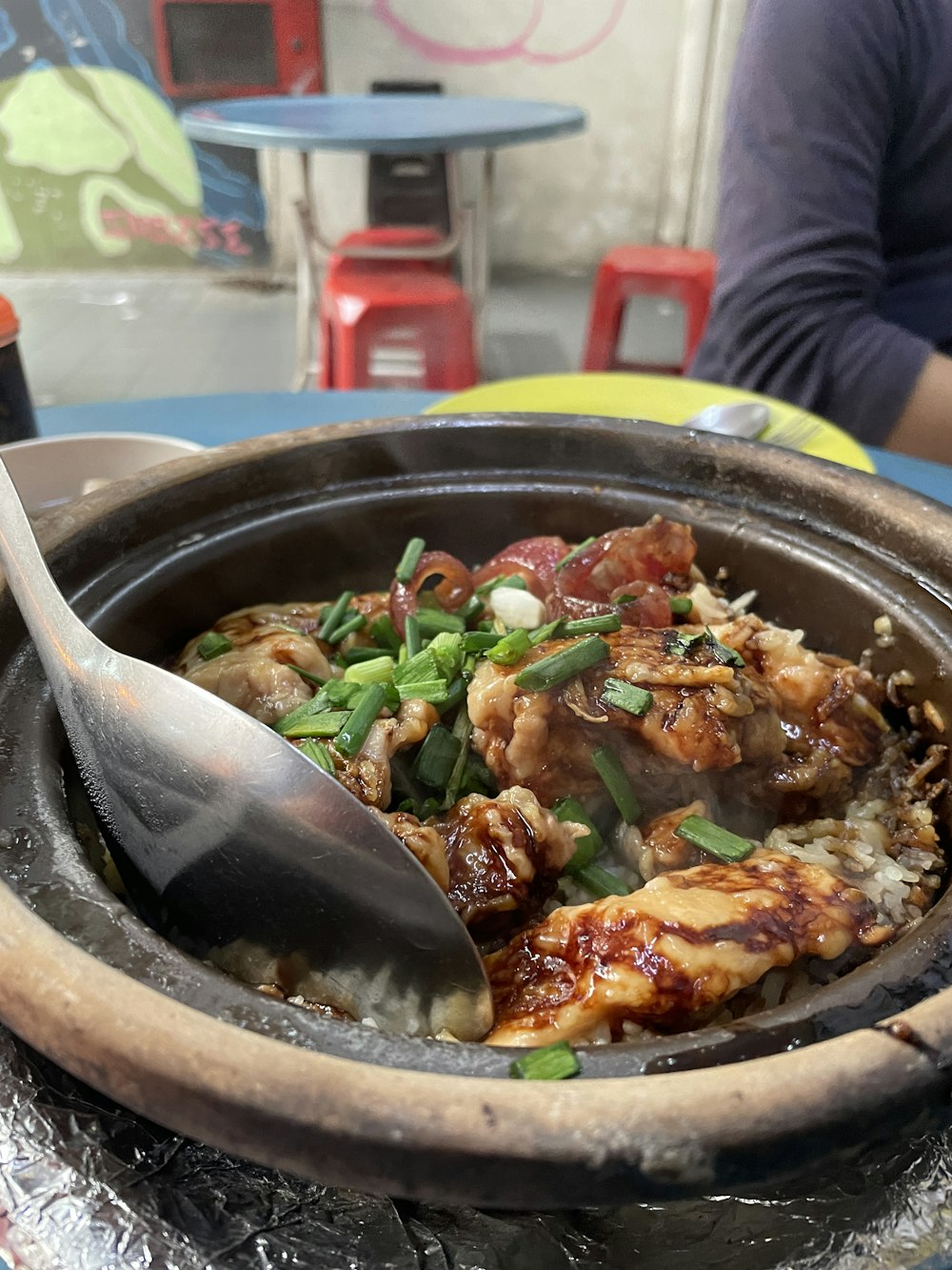 a bowl of food with a spoon in it