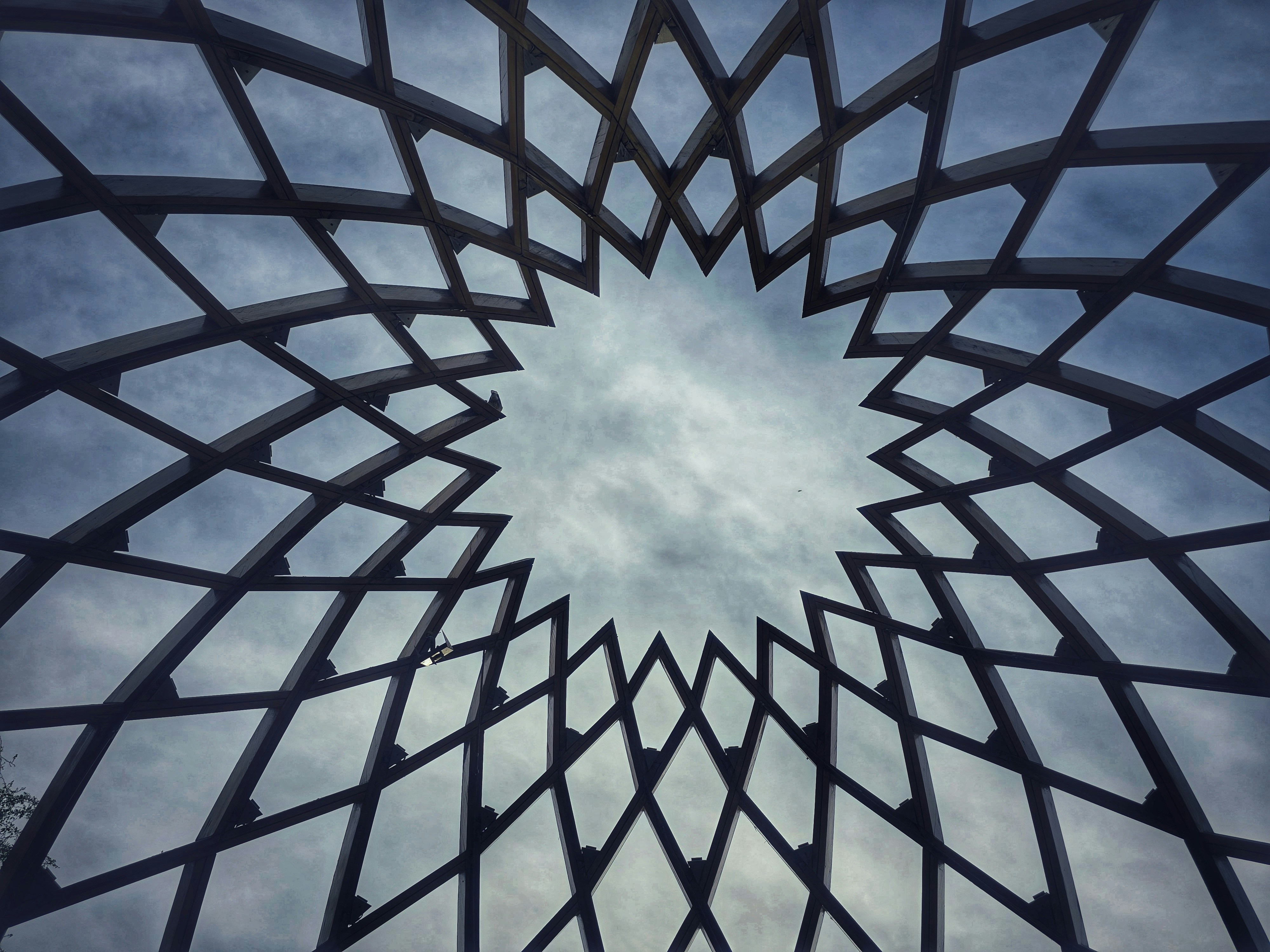 a metal structure with a sky in the background