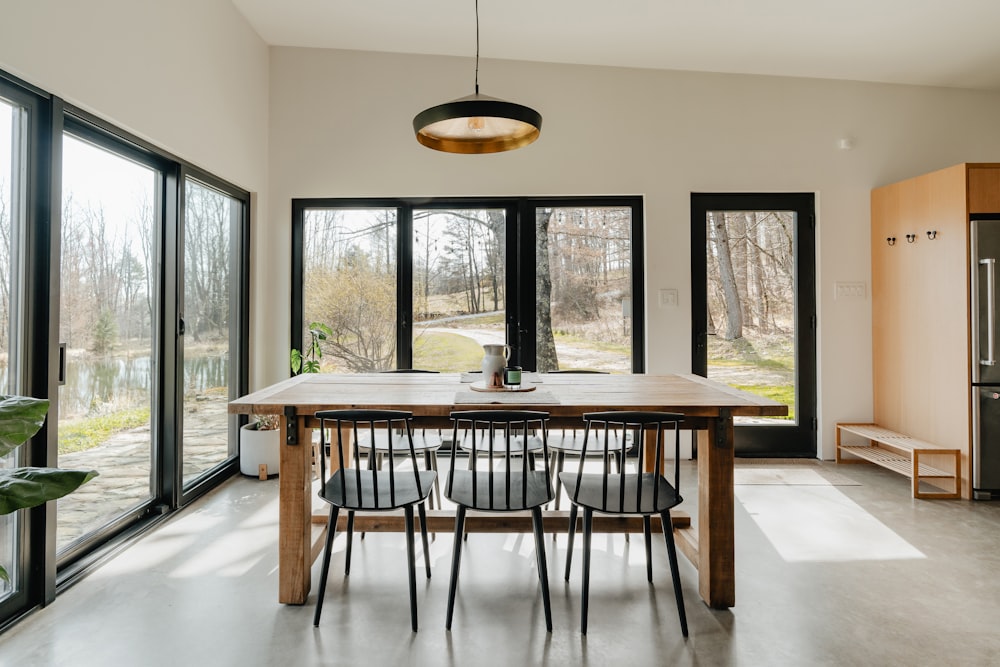 a dining room with a table and chairs