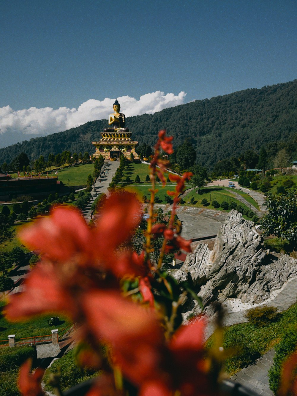 a view of a hill with a statue on top of it