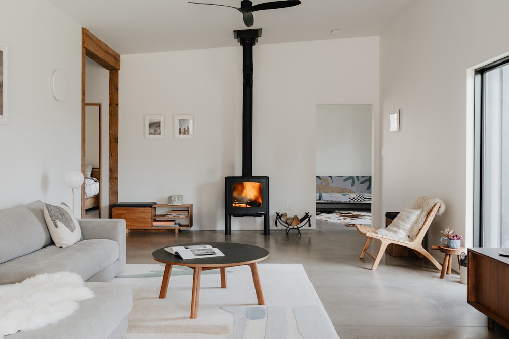 a living room filled with furniture and a fire place