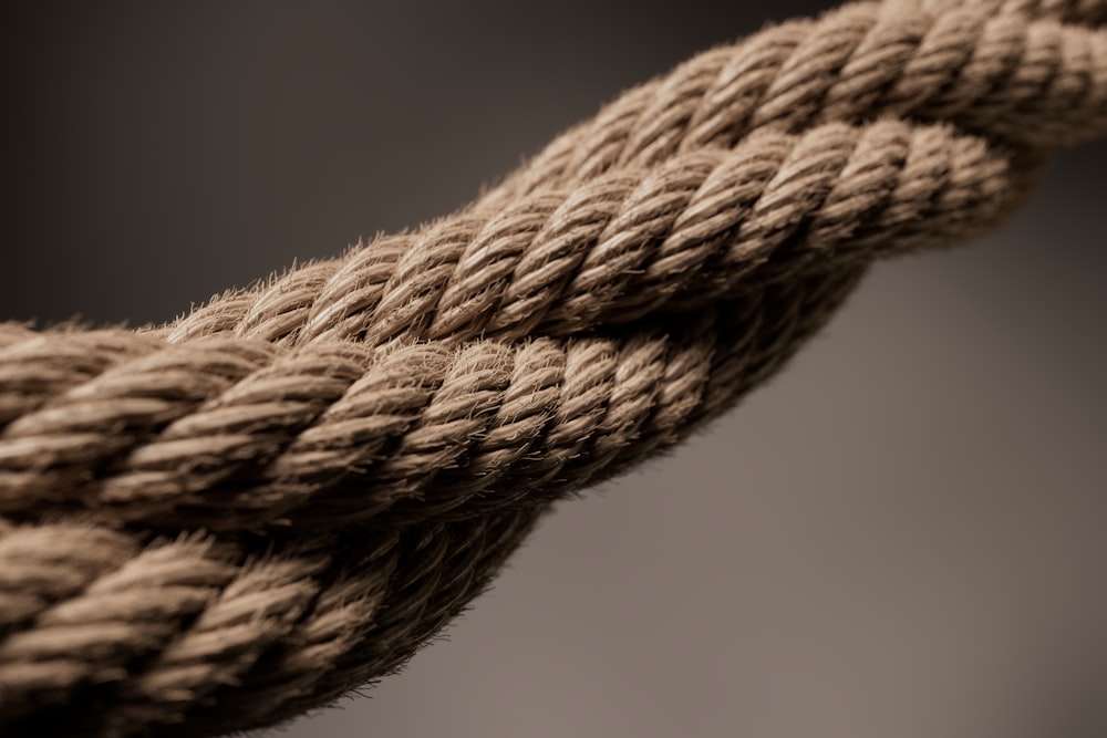 a close up of a rope with a black background