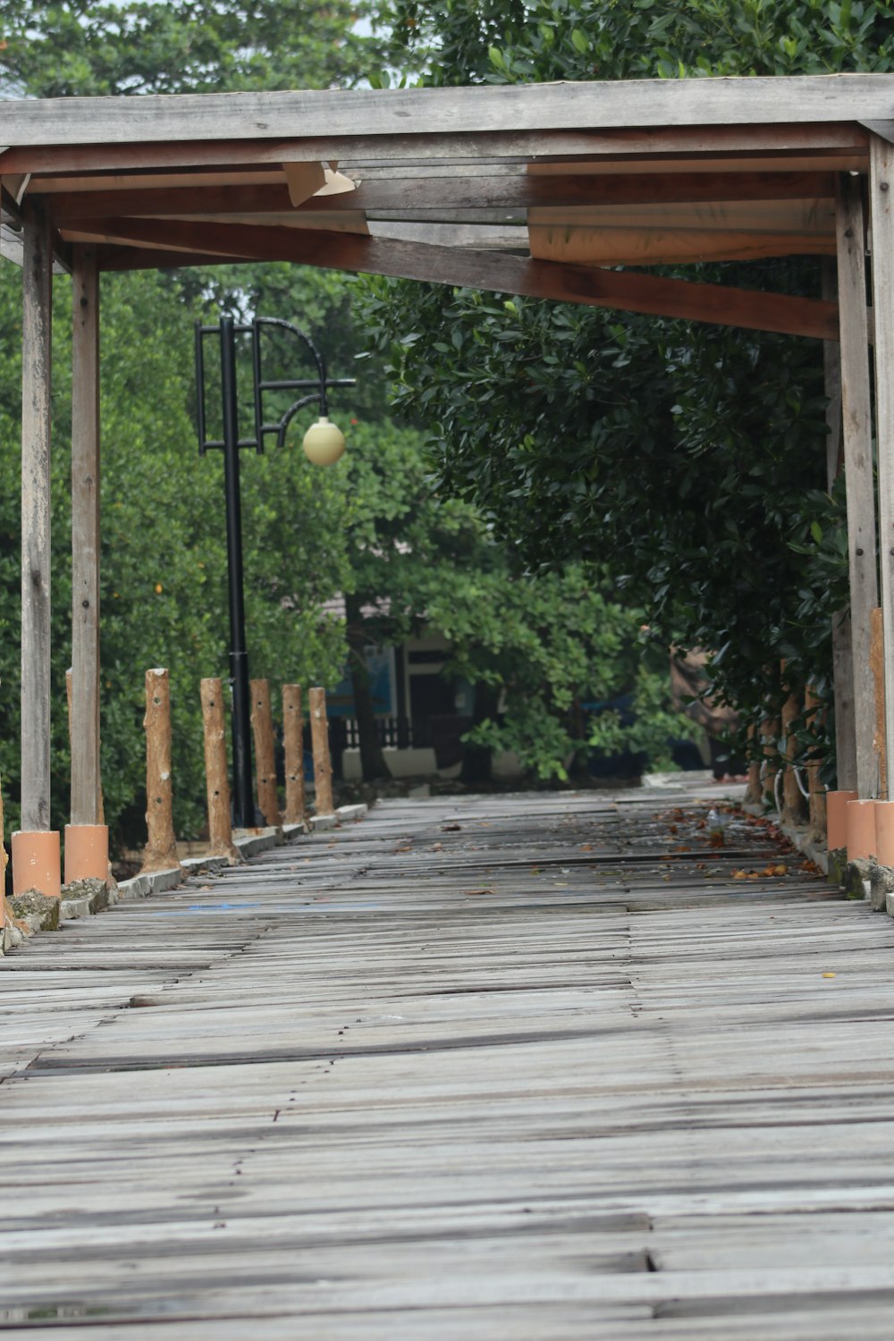 a wooden walkway with a ball on top of it