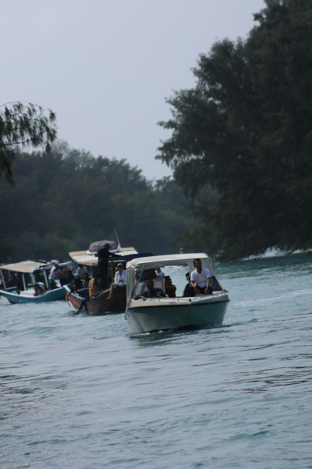 a group of people on a boat in the water