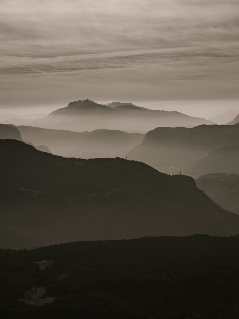 a black and white photo of a mountain range