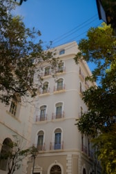 a large white building with balconies and balconies