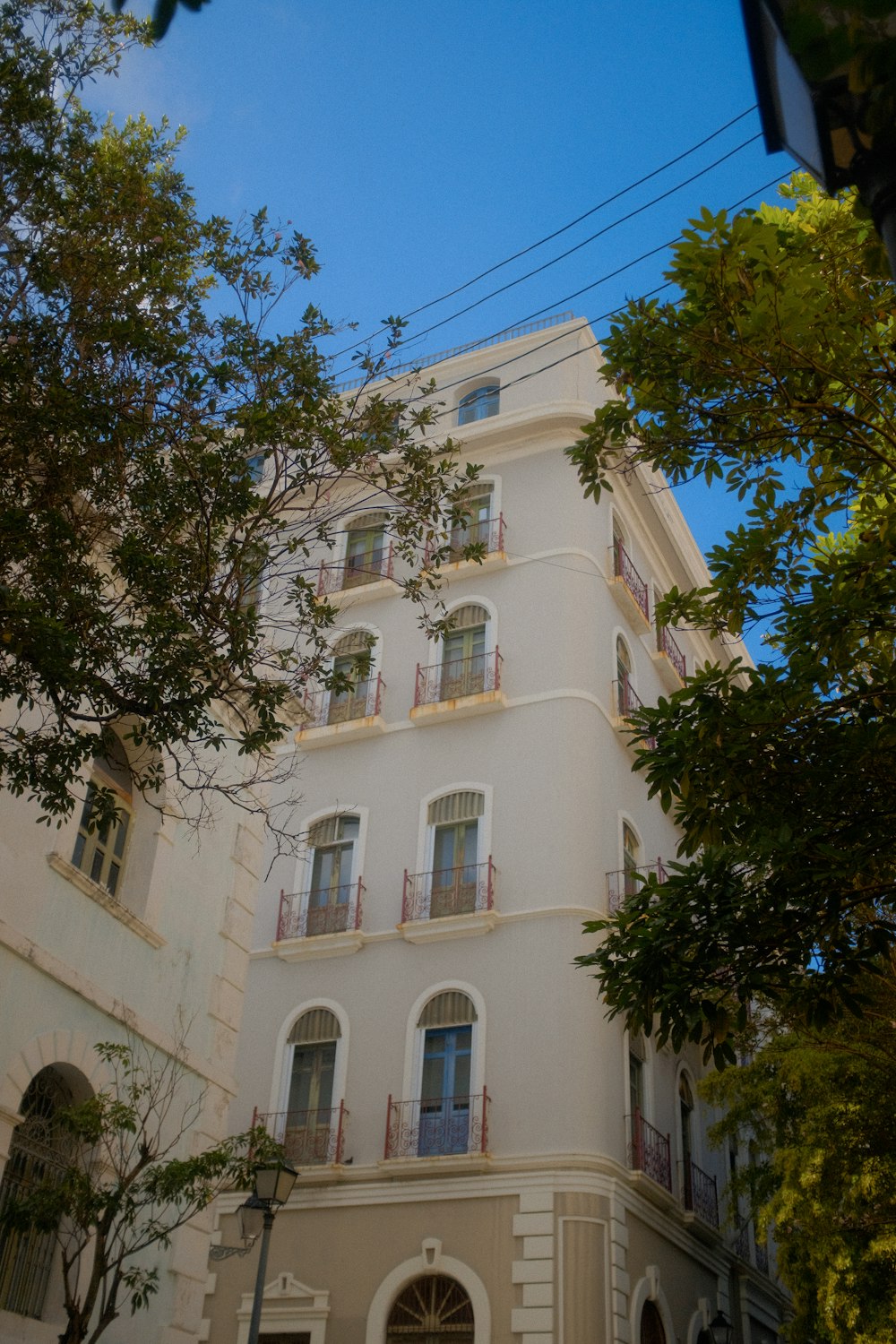 a large white building with balconies and balconies