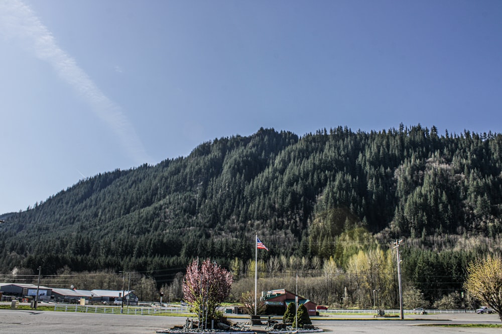 a parking lot with a mountain in the background