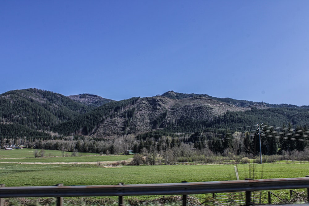 a view of a mountain range from a highway