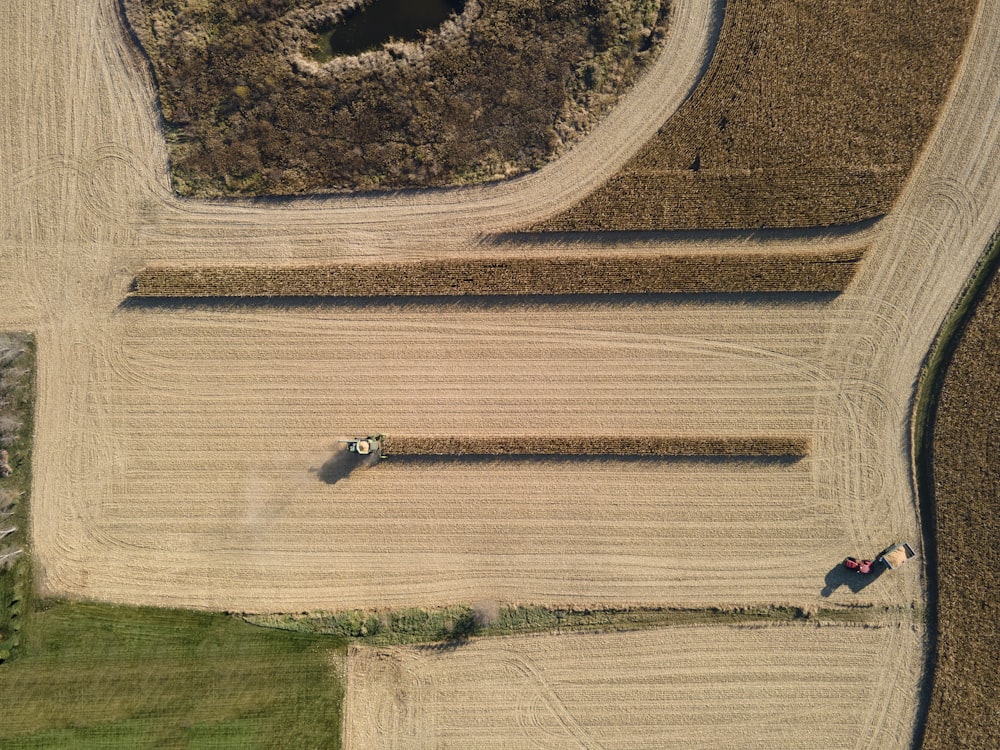 an aerial view of a farm field with a tractor