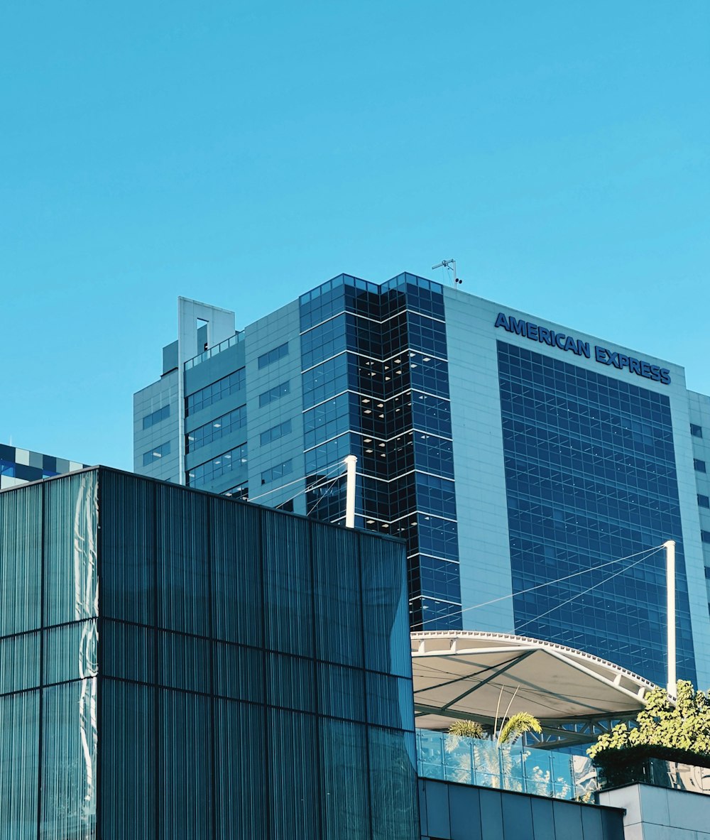 an airplane is flying over a building in the city