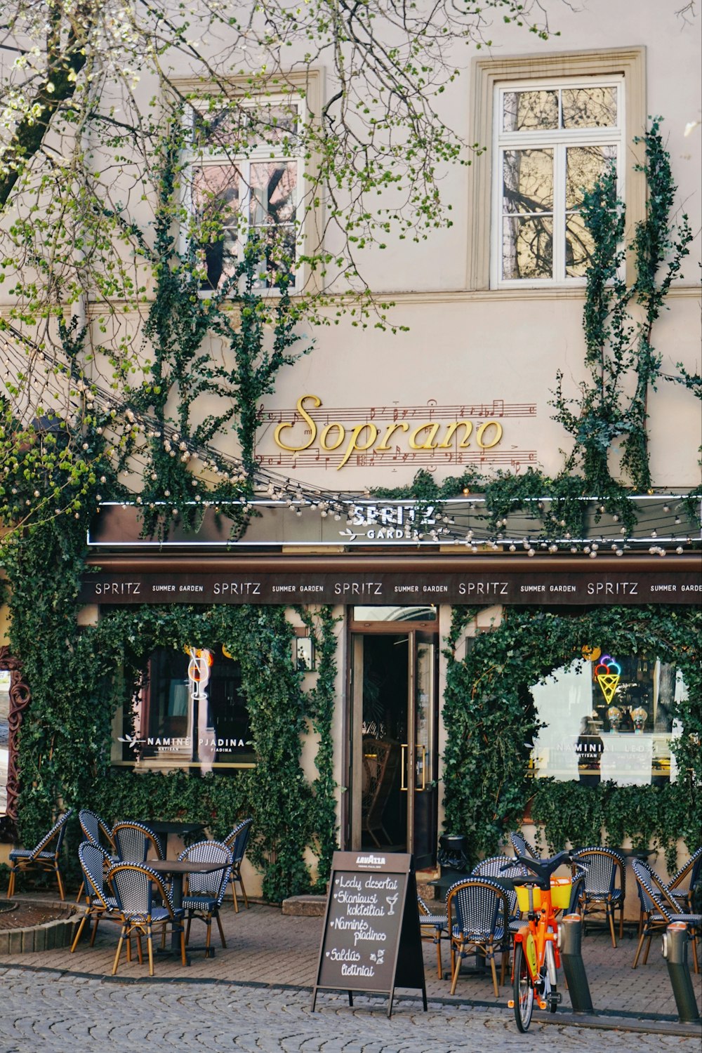 a restaurant with a bicycle parked outside of it