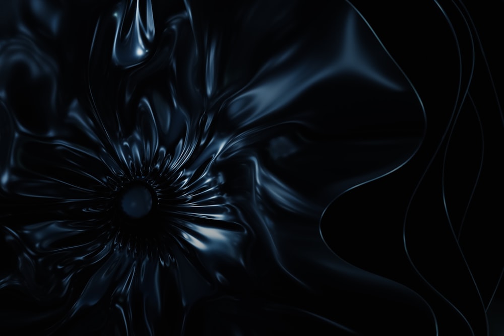 a black background with a large flower in the center