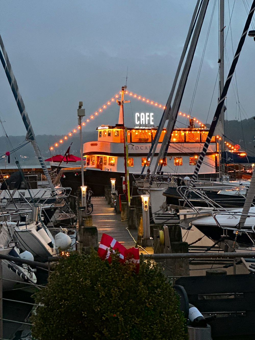 a group of boats docked at a pier