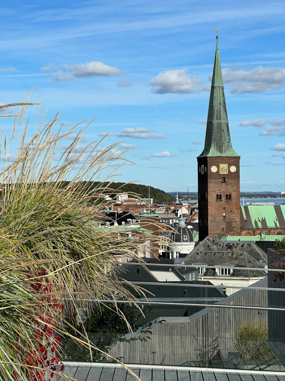 a tall clock tower towering over a city