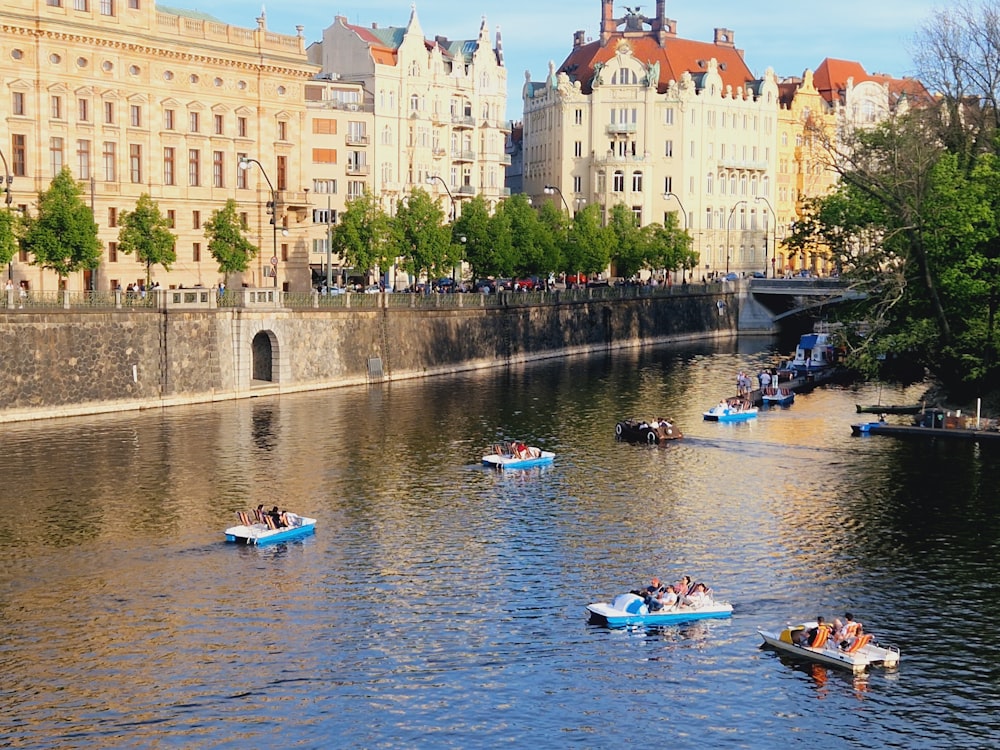 a group of people in boats floating down a river