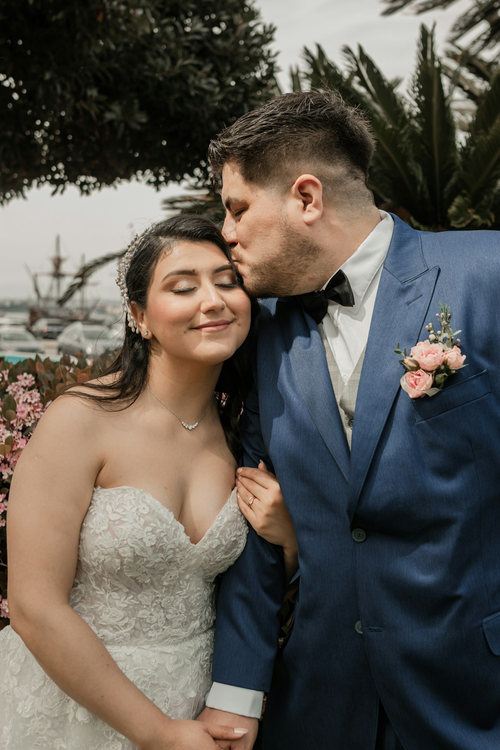 a bride and groom are posing for a picture