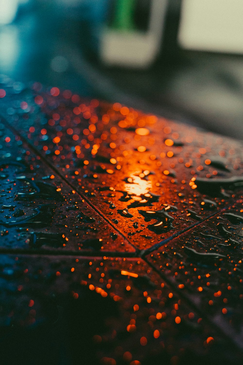 a close up of a wet surface with drops of water