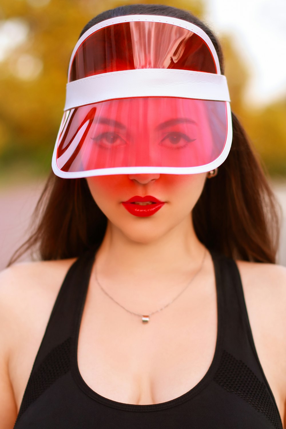 a woman wearing a plastic visor over her face