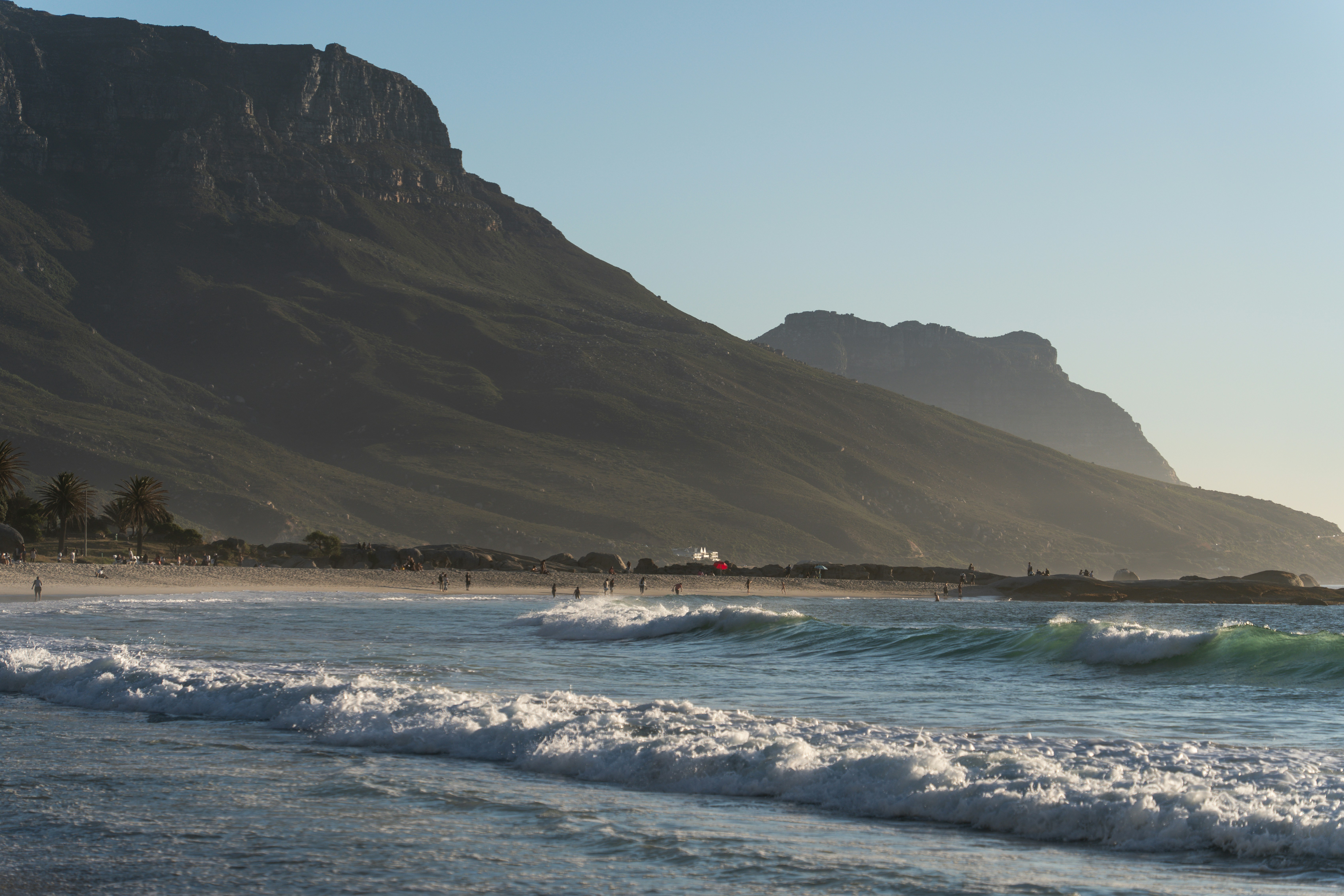 a beach with a mountain in the background