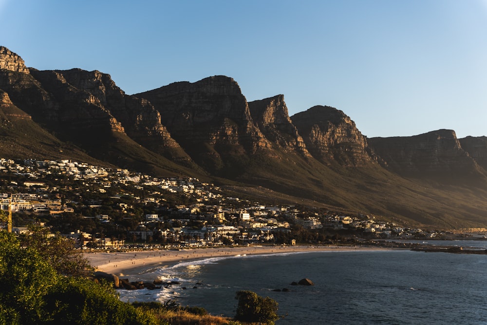 a view of a beach with mountains in the background