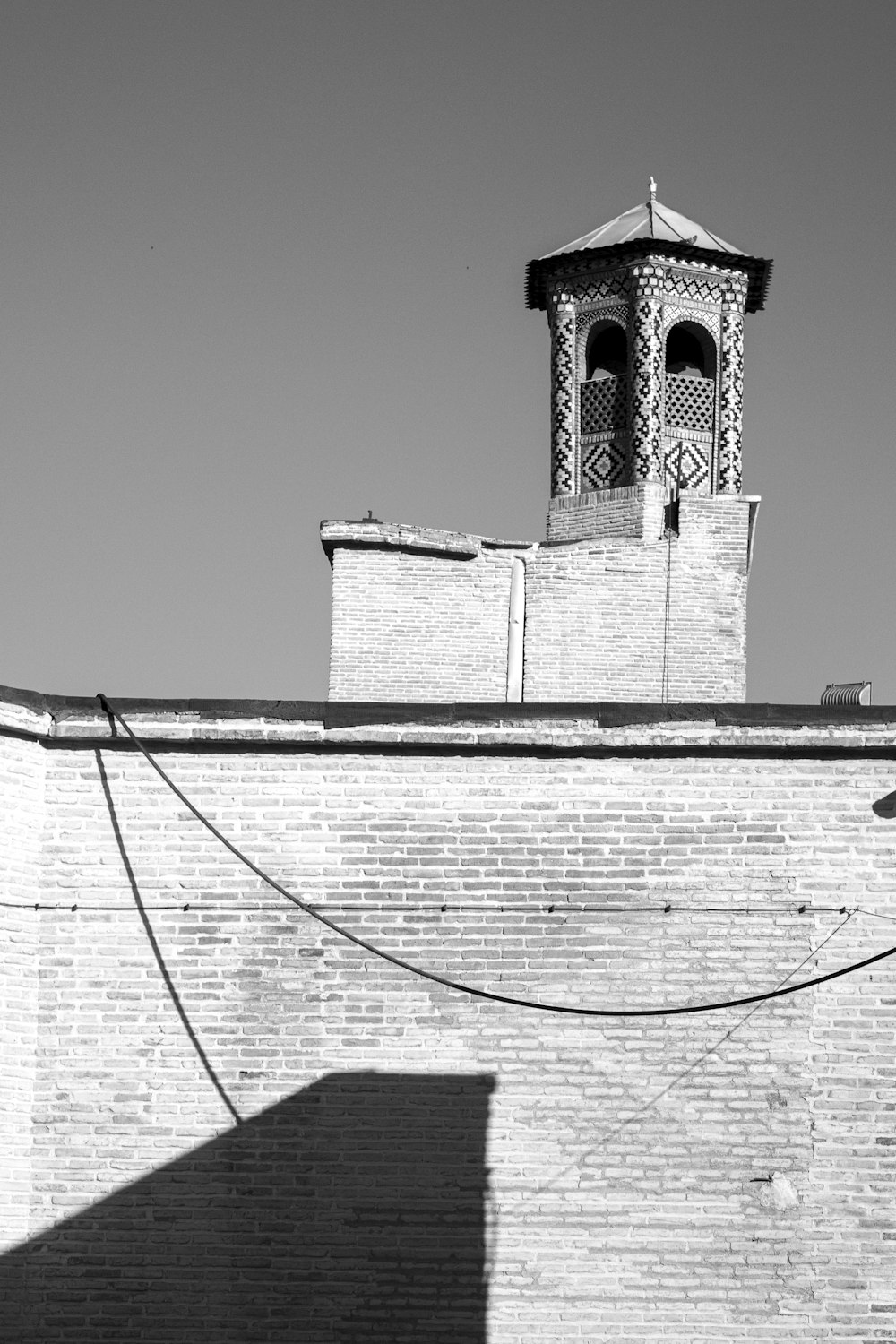 a black and white photo of a clock tower