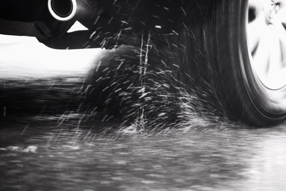 a black and white photo of a car tire