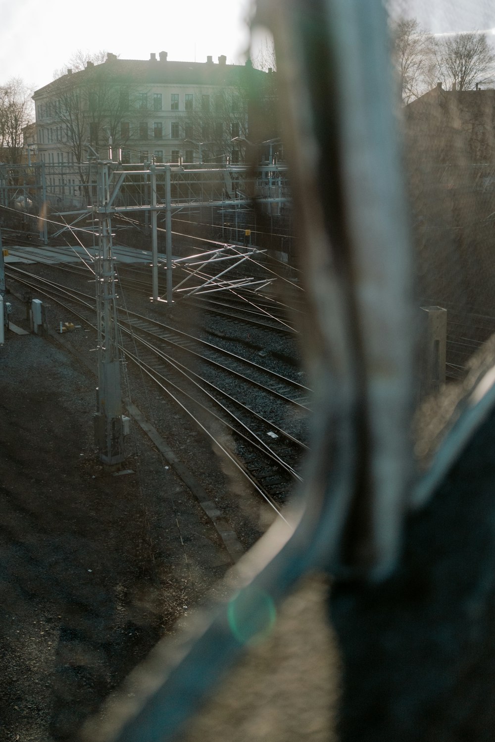 a view of a train track through a window