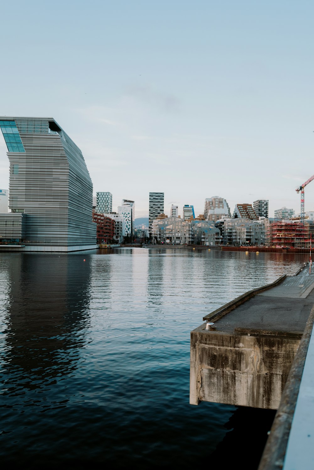 a large body of water with a city in the background