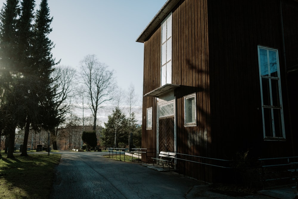 a large brown building sitting on the side of a road