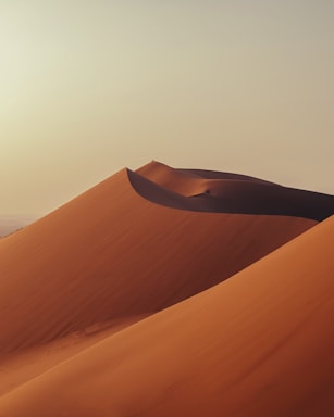 a large sand dune in the middle of a desert