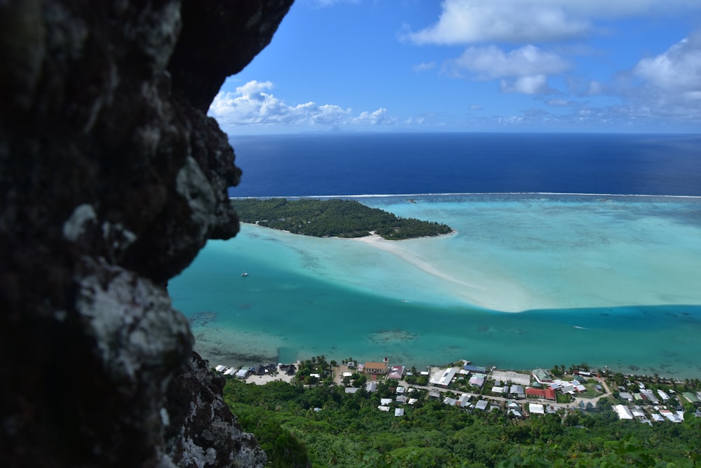 a view of a tropical island from a cliff