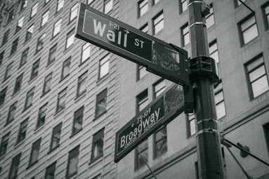 a black and white photo of a street sign