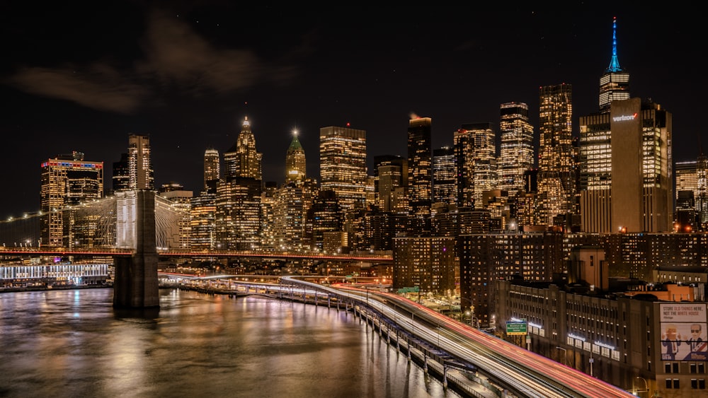 a view of a city at night from a bridge