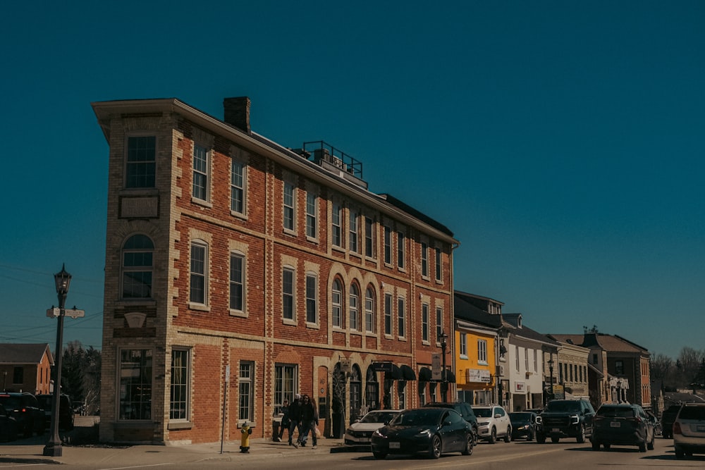 a large brick building sitting on the side of a road