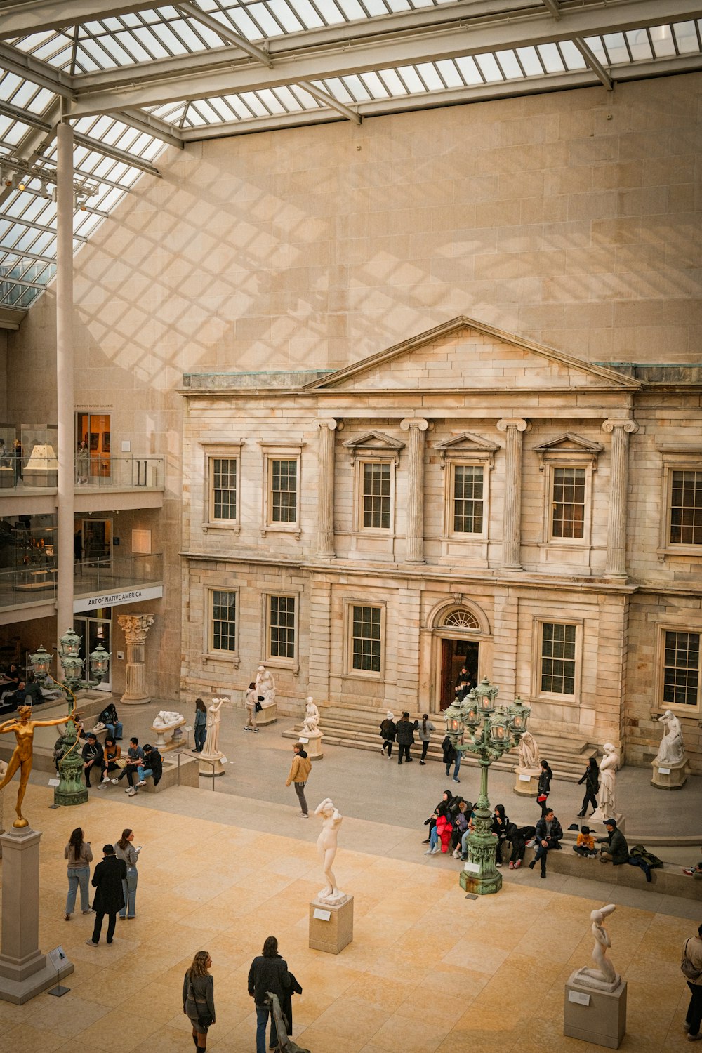 a group of people standing around a museum