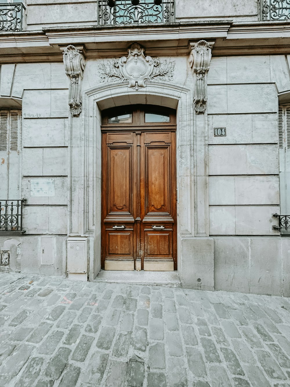 a large wooden door on the side of a building