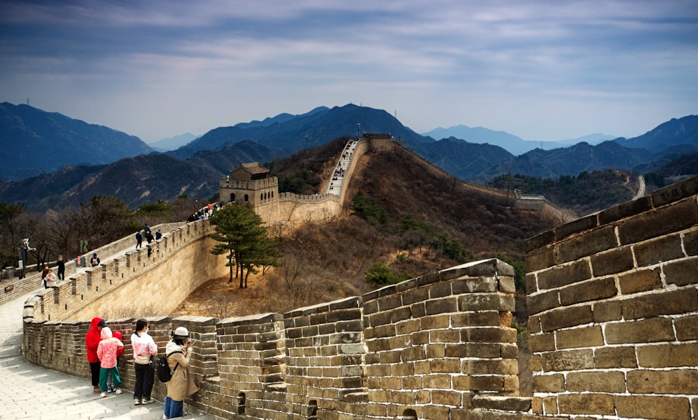 a group of people walking up the side of a wall