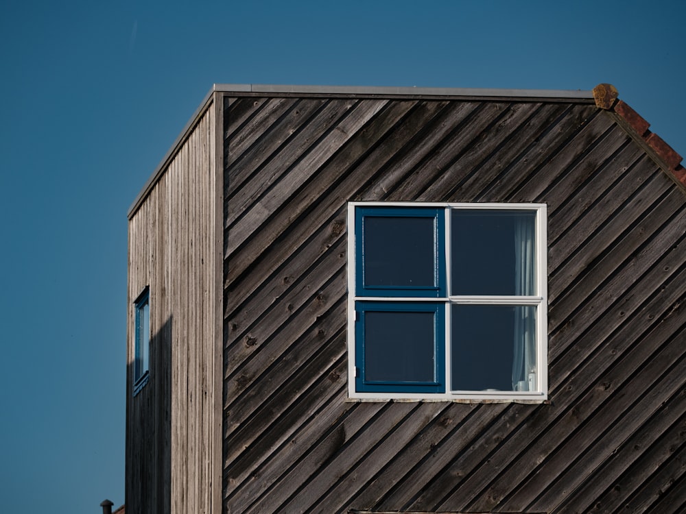 a wooden building with a window on the side of it