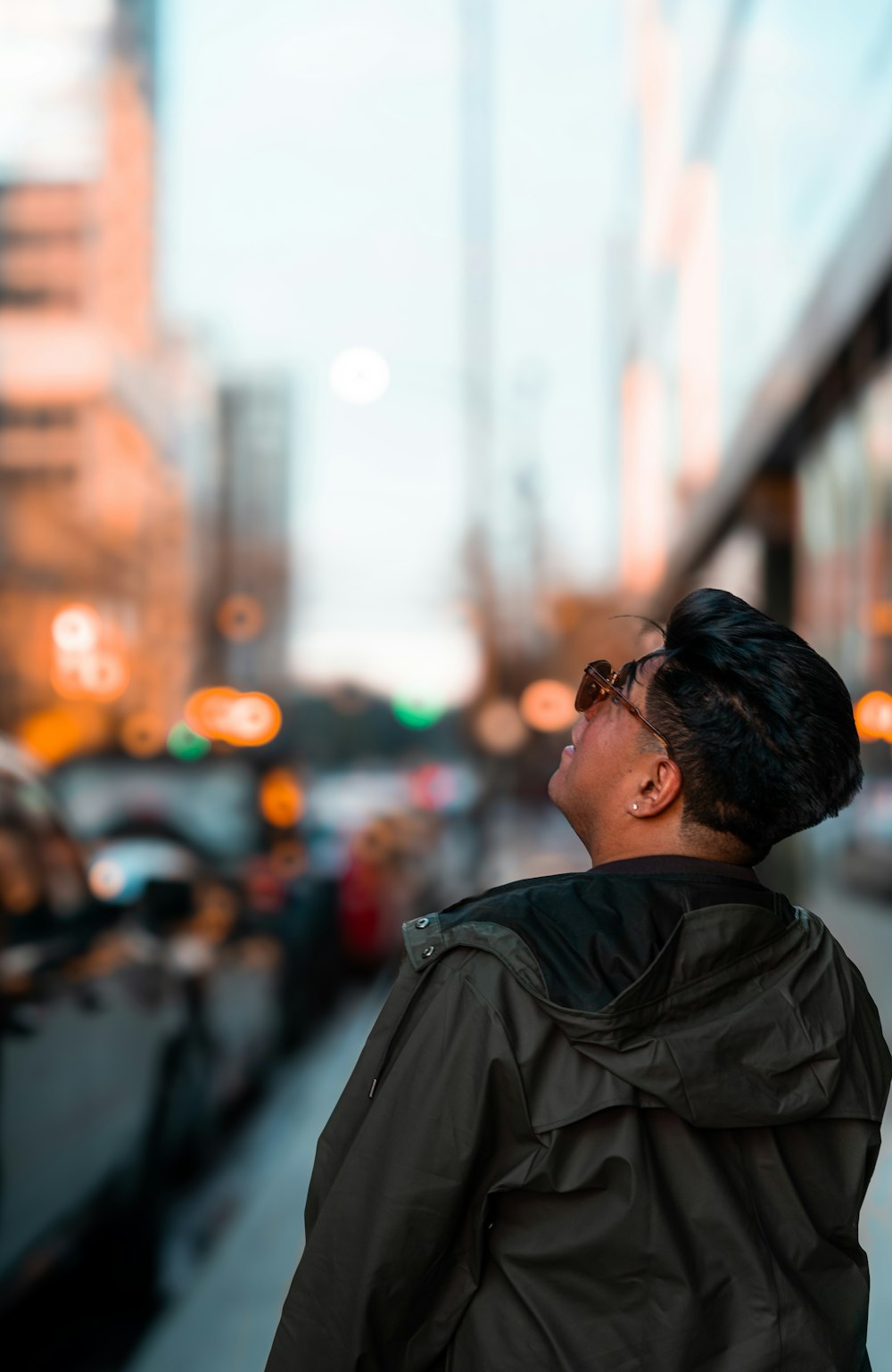 a man standing on the side of a street