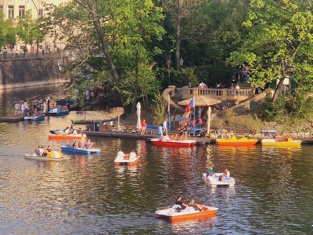 a group of people in small boats on a river