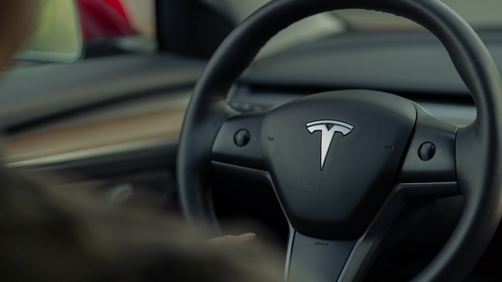 a close up of a steering wheel of a car