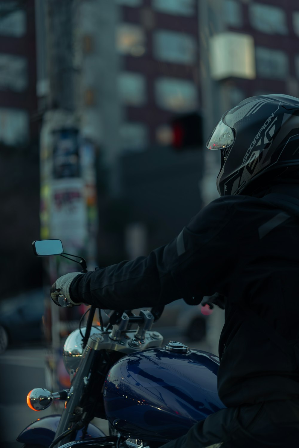 a person riding a motorcycle on a city street